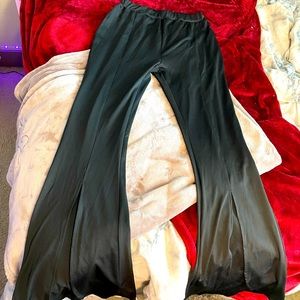 Long black pants with slits up the legs